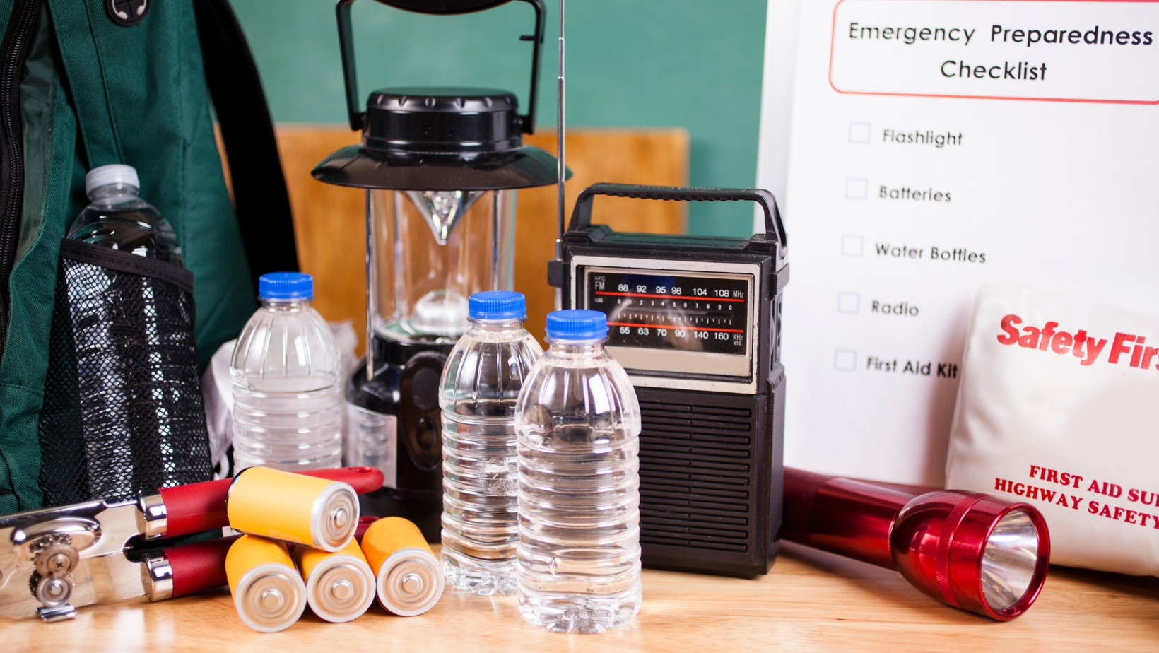 Emergency preparedness supplies including water, a radio, batteries, and more.