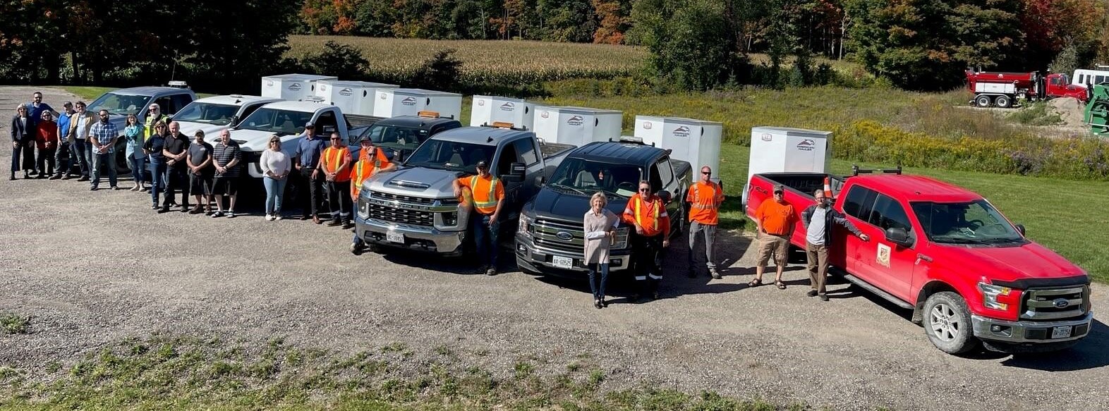 A row of trucks with emergency support service trailers in Dufferin County.