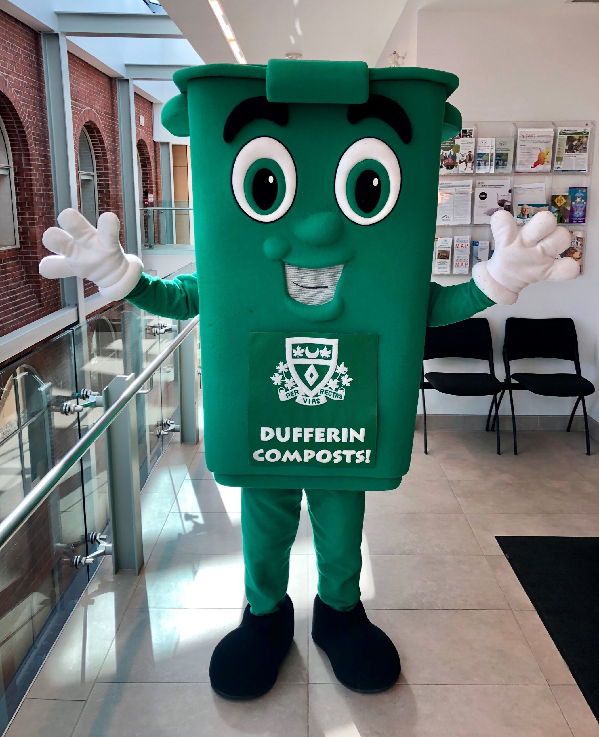 mascot dressed as a green bin with a smiling face
