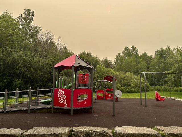 Playground with no children with smokey air in background